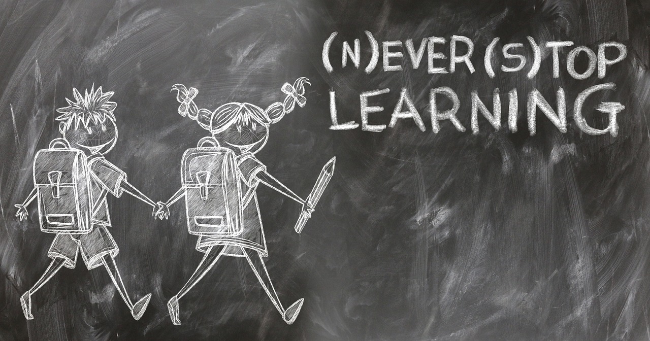 never stop learning wrote on a blackboard